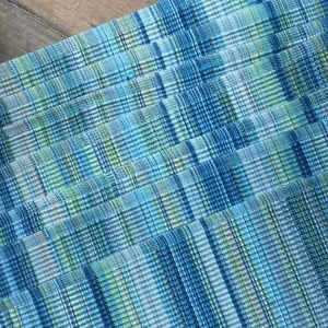 Never used placemats.  Spring colors.  Set of 7